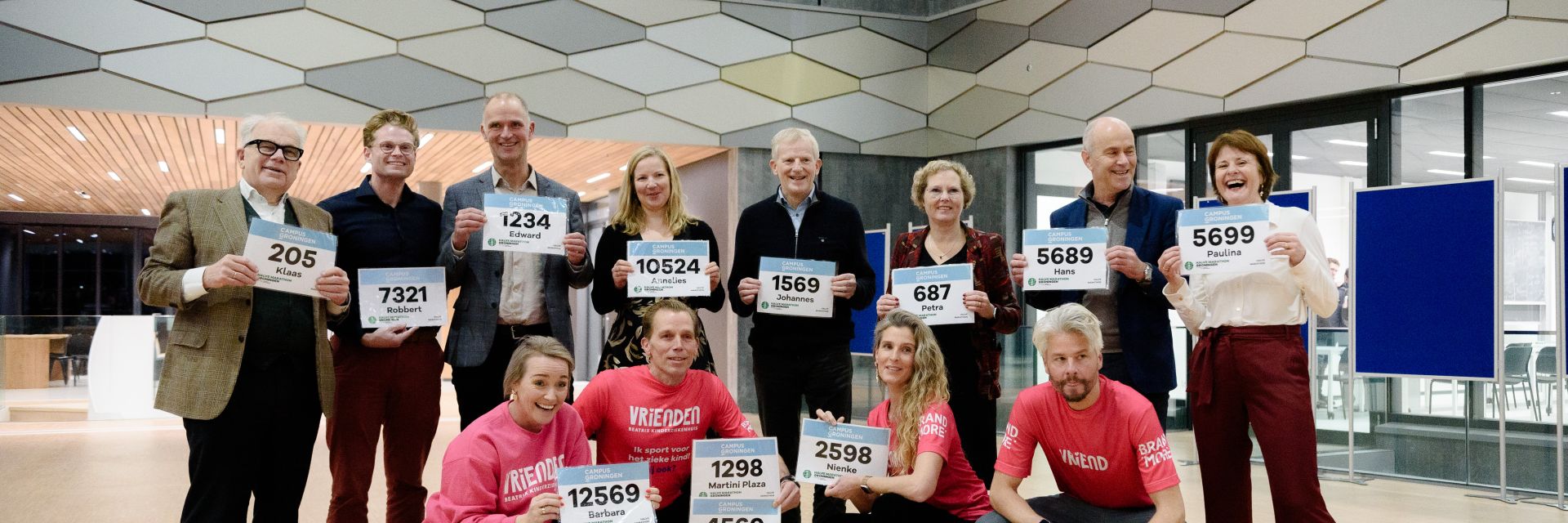 Startnumbers for the Groningen Half Marathon presented during Campus Groningen Christmas drinks